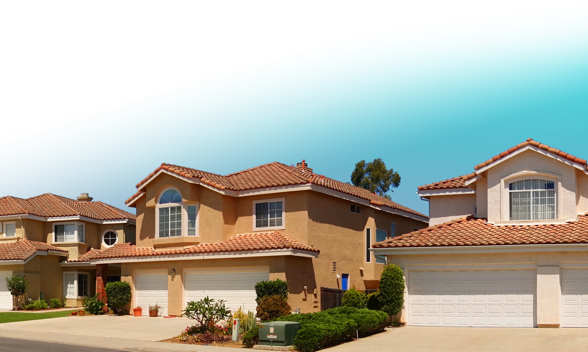 An image of houses with gradient blue sky